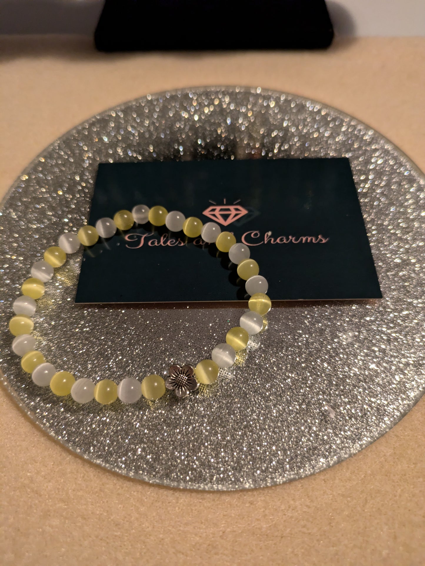 Yellow & White Cats Eye Bead Bracelet with a Daisy Charm