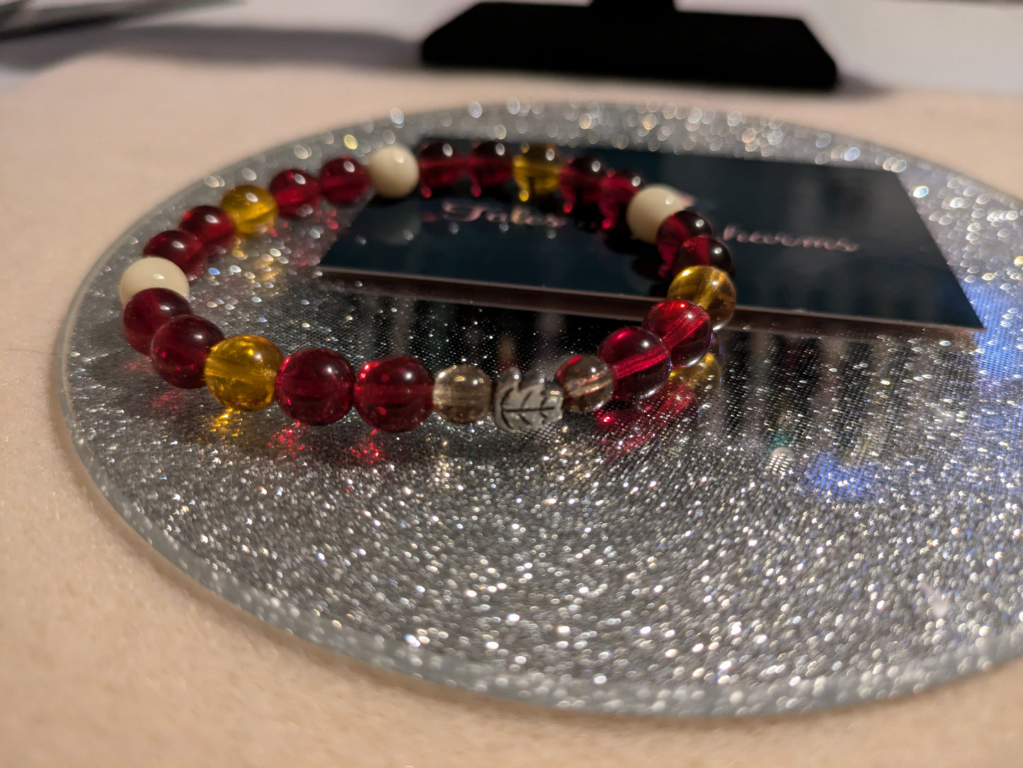 Autumn Inspired Glass Bead Bracelet with a silver plated Leaf charm. 18cm